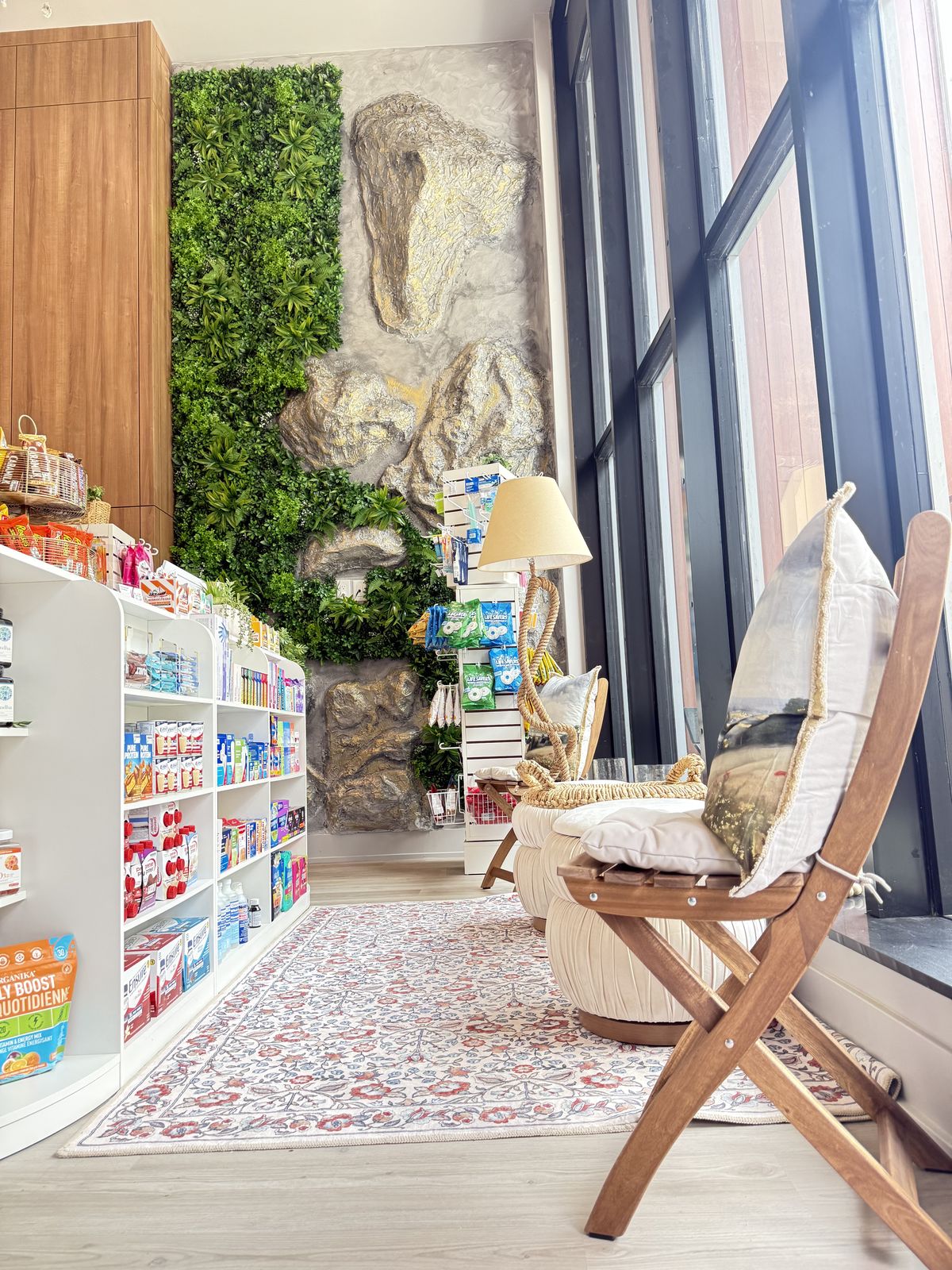 Bright living-wall seating nook inside Cunard Pharmacy