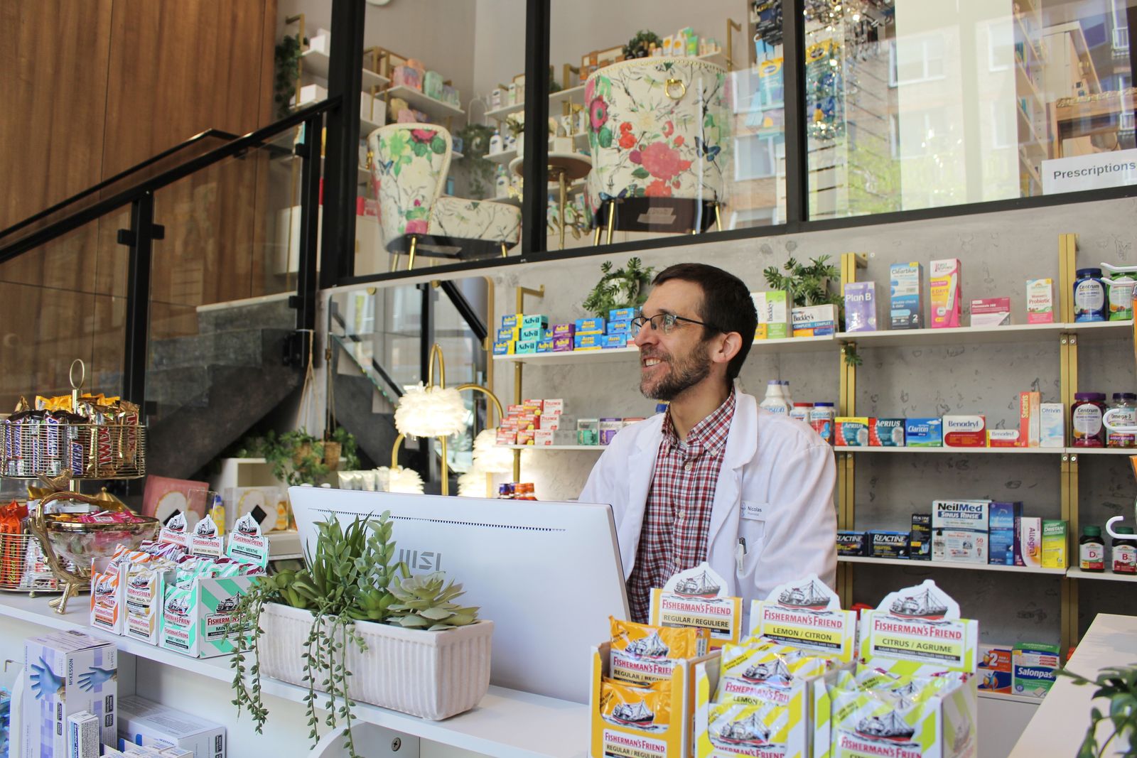 Pharmacist working with a patient at the Cunard Pharmacy counter